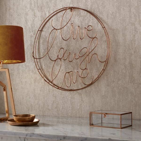 Live Laugh Love metallic wall art on wall